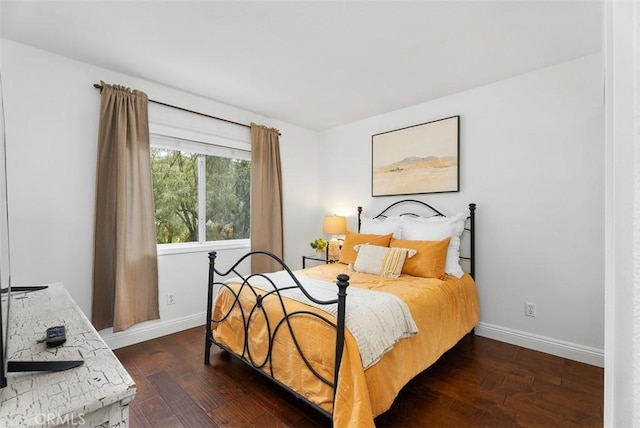 bedroom featuring dark wood-type flooring