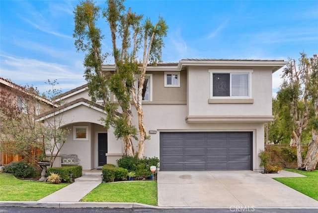 view of front of property with a garage and a front yard