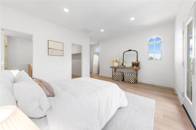 bedroom with light hardwood / wood-style flooring