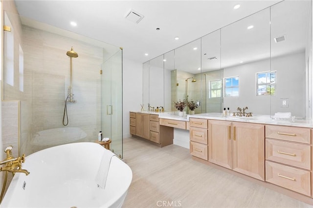 bathroom with vanity, plus walk in shower, and hardwood / wood-style floors