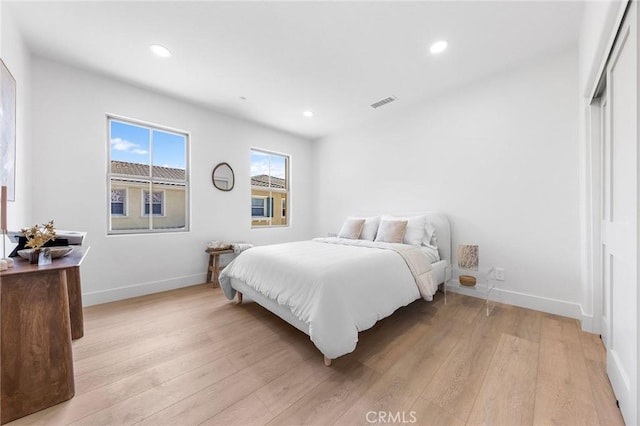 bedroom with light wood-type flooring