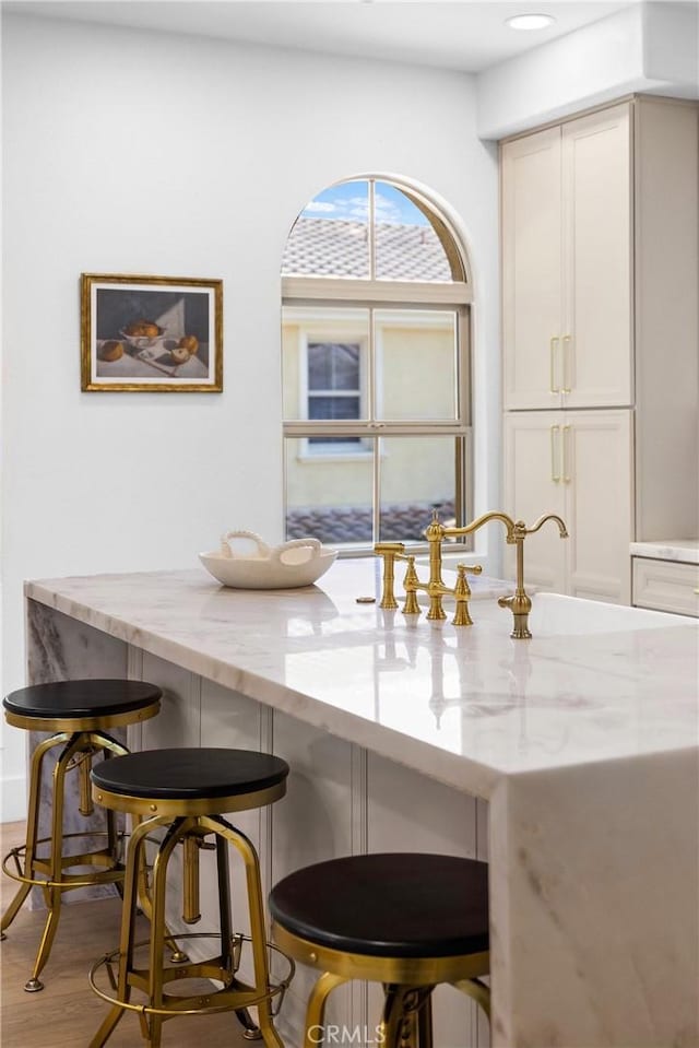 dining area featuring sink and light wood-type flooring