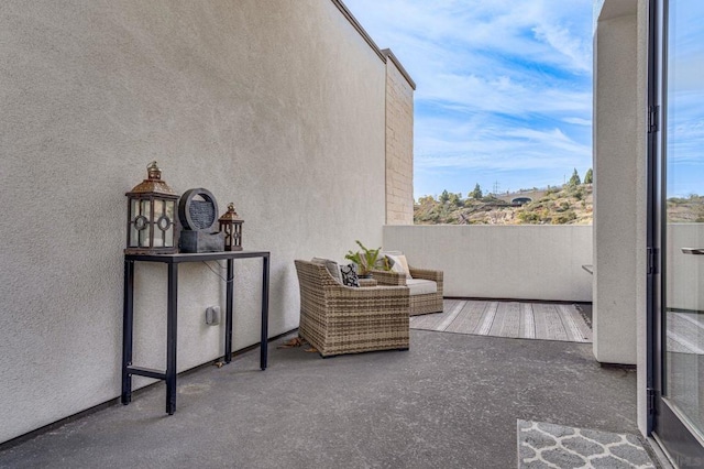 view of patio / terrace with a balcony