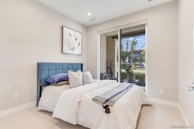 carpeted bedroom featuring access to exterior