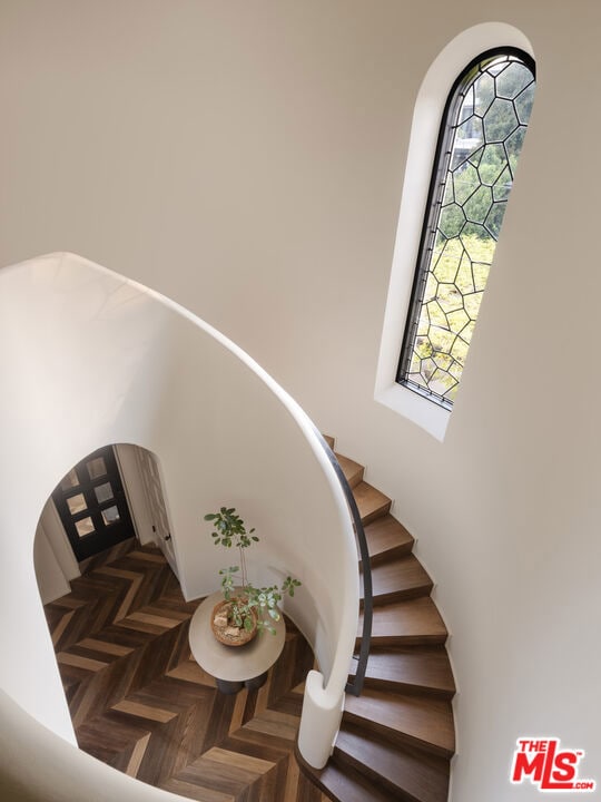 staircase with parquet floors