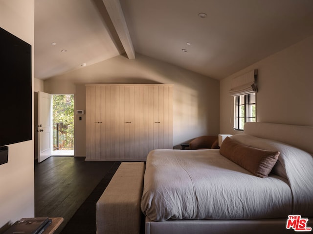 bedroom featuring dark wood-type flooring, lofted ceiling with beams, and multiple windows