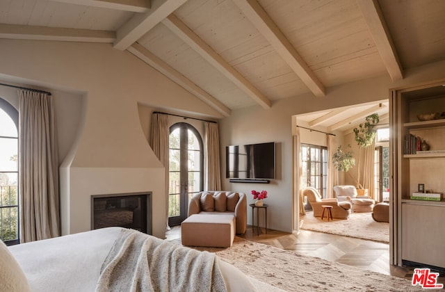 bedroom featuring lofted ceiling with beams and light parquet floors