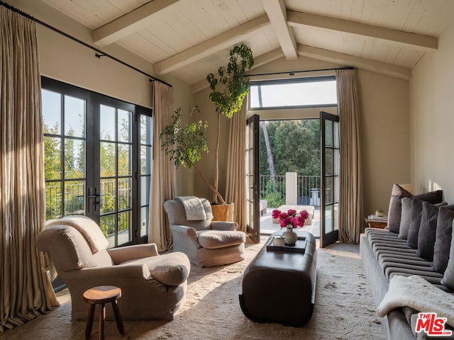 sitting room featuring lofted ceiling with beams, french doors, and wooden ceiling