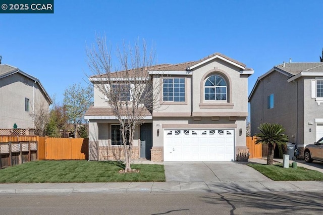 view of front property with a garage and a front yard