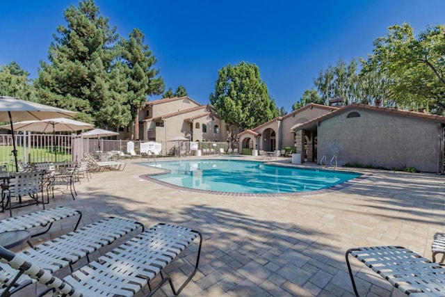 view of swimming pool featuring a patio area