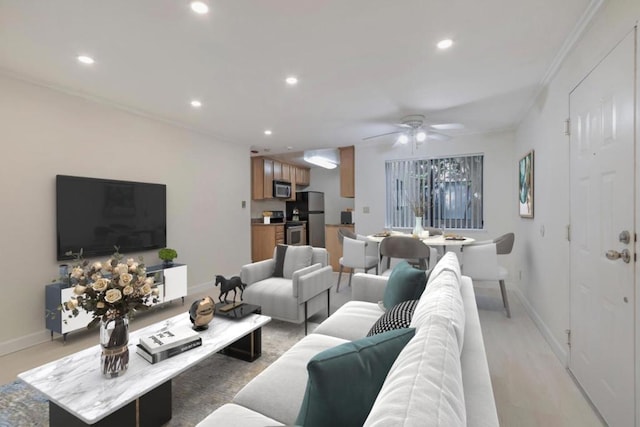 living room featuring crown molding and ceiling fan