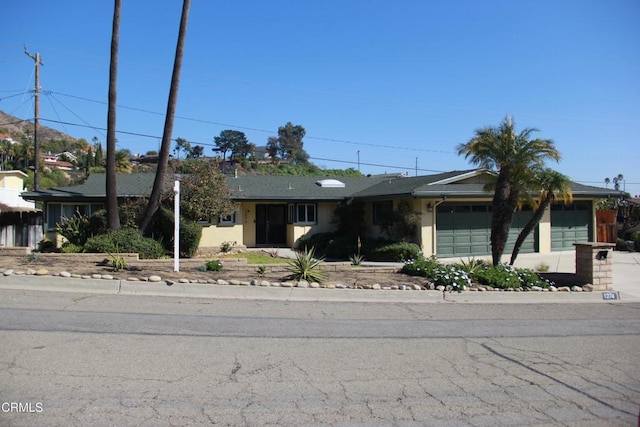 ranch-style home with a garage