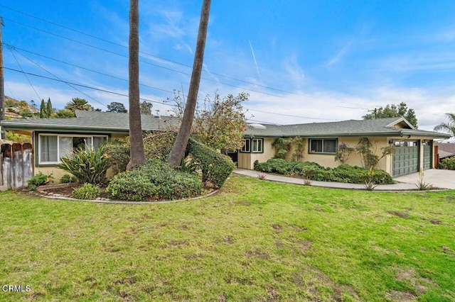 ranch-style house with a garage and a front yard