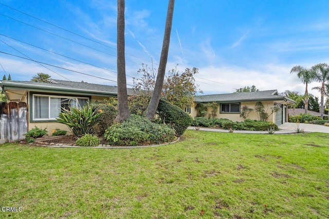 ranch-style house featuring a front lawn