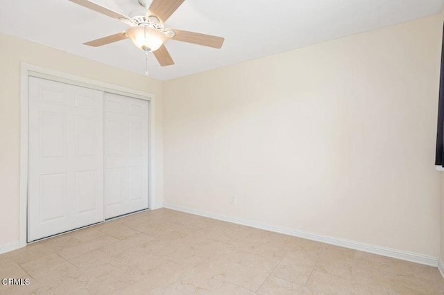 unfurnished bedroom with a closet and ceiling fan