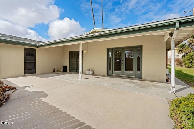 rear view of property featuring a patio area