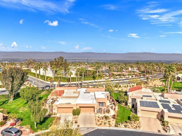 birds eye view of property with a mountain view