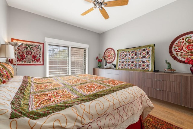 bedroom with light hardwood / wood-style flooring and ceiling fan