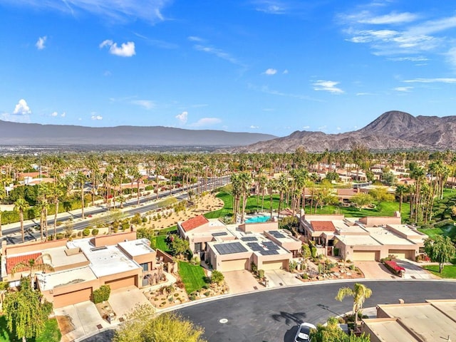 birds eye view of property with a mountain view