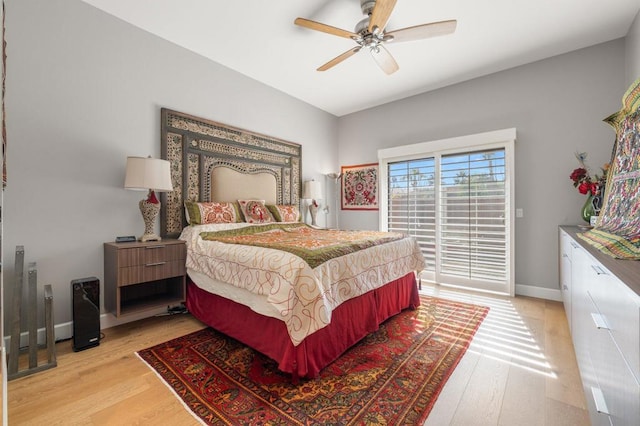 bedroom with ceiling fan, light hardwood / wood-style floors, and access to outside