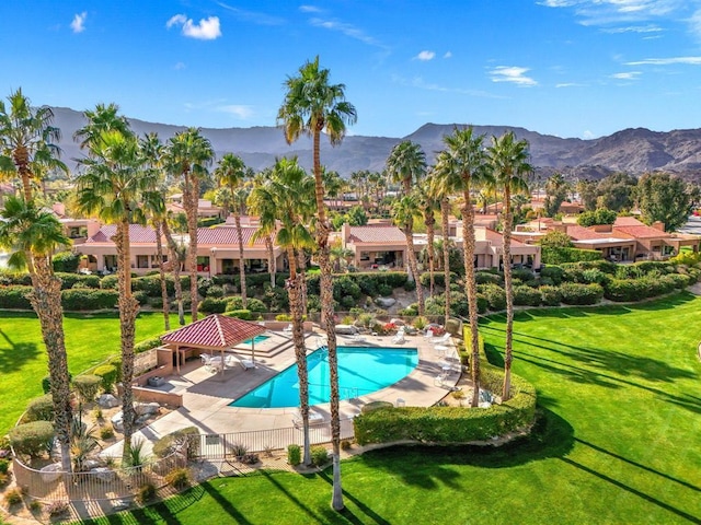 view of swimming pool with a gazebo, a yard, a mountain view, and a patio