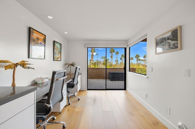 office with light hardwood / wood-style flooring