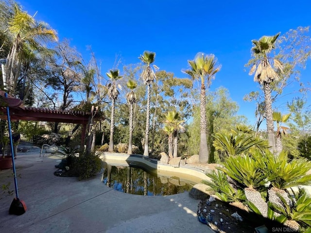 view of swimming pool with a pergola and a patio area