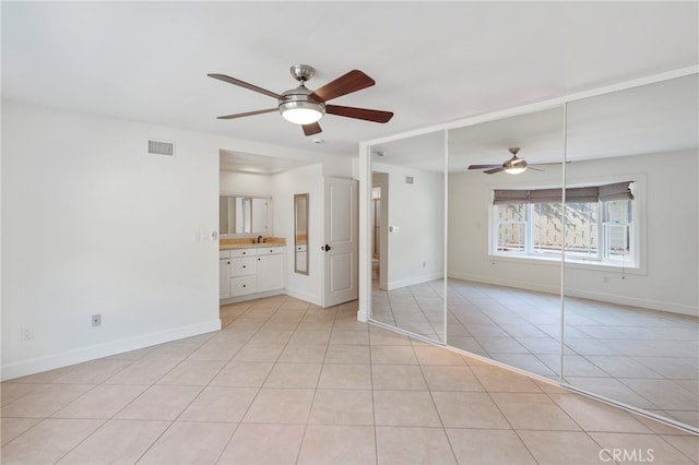 unfurnished bedroom with light tile patterned flooring