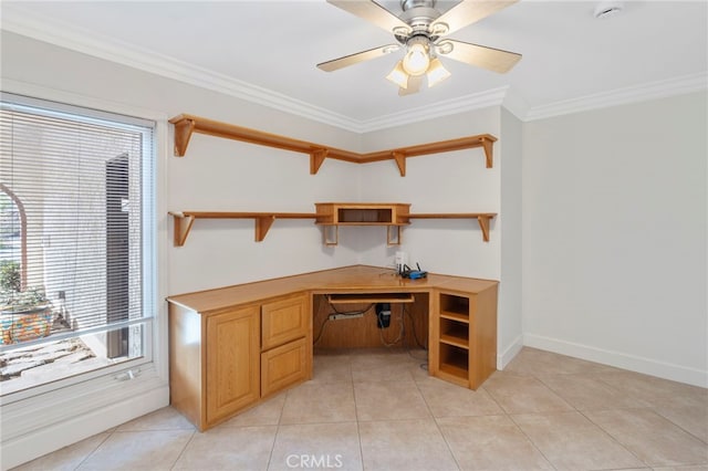 office featuring ornamental molding, built in desk, ceiling fan, and light tile patterned floors