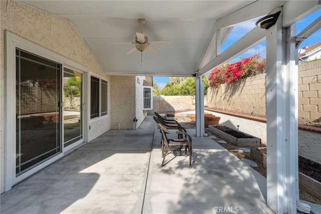 view of patio featuring ceiling fan