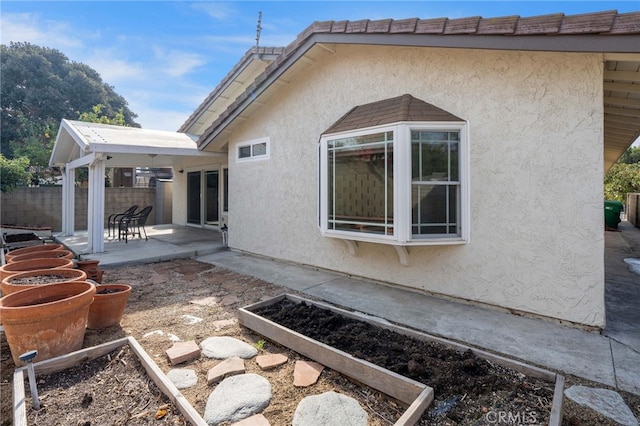 view of home's exterior with a patio