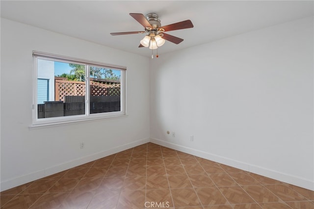 unfurnished room with ceiling fan