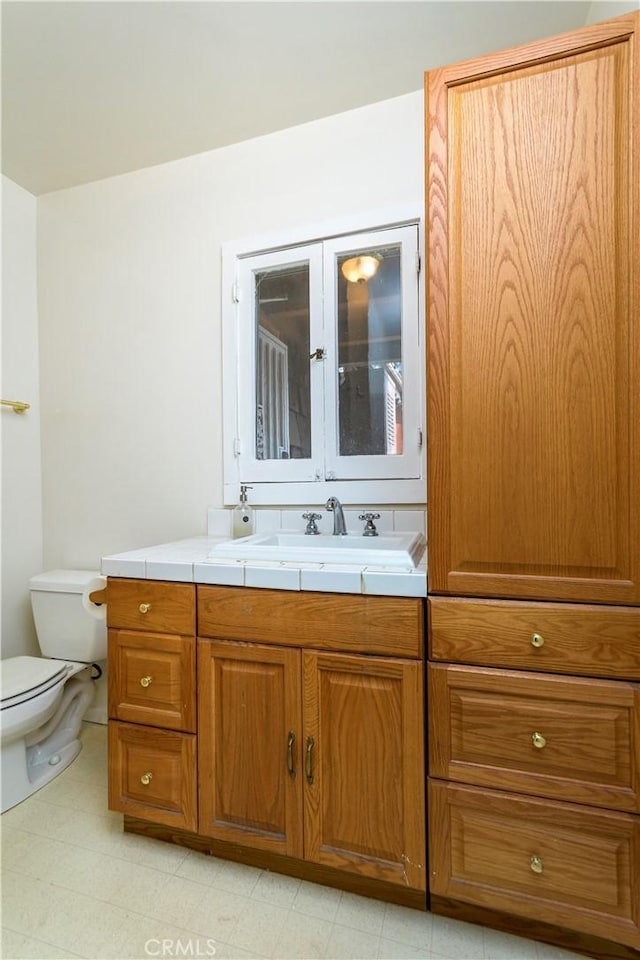 bathroom with vanity and toilet