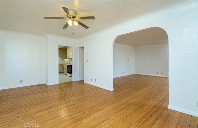 spare room with ceiling fan and light hardwood / wood-style floors