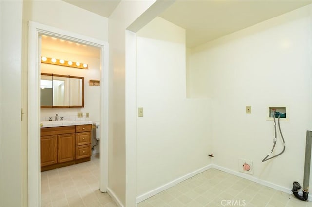 laundry area with washer hookup and sink