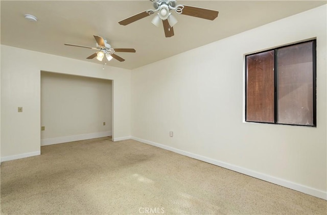 unfurnished room with ceiling fan