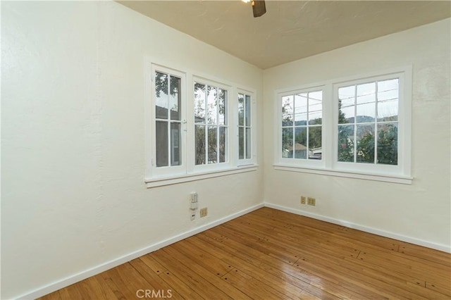 unfurnished room featuring hardwood / wood-style floors