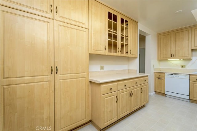 kitchen featuring light brown cabinetry and dishwasher