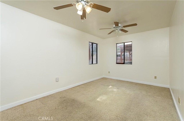 empty room with ceiling fan and carpet flooring