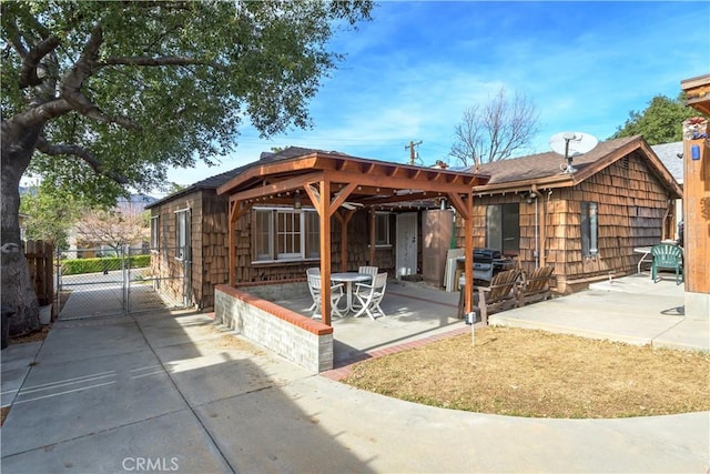 rear view of property with a patio area