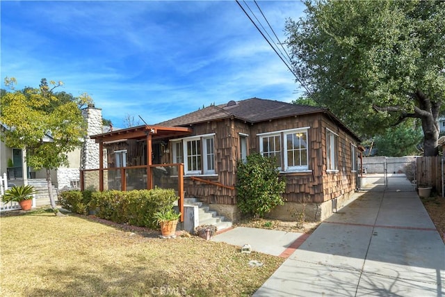 bungalow with a front lawn