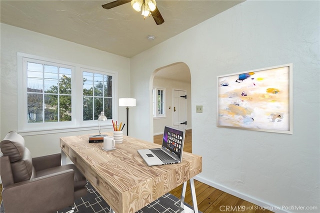 home office featuring hardwood / wood-style floors and ceiling fan