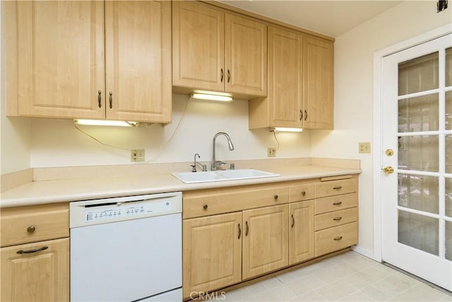 kitchen featuring dishwasher, sink, and light brown cabinets