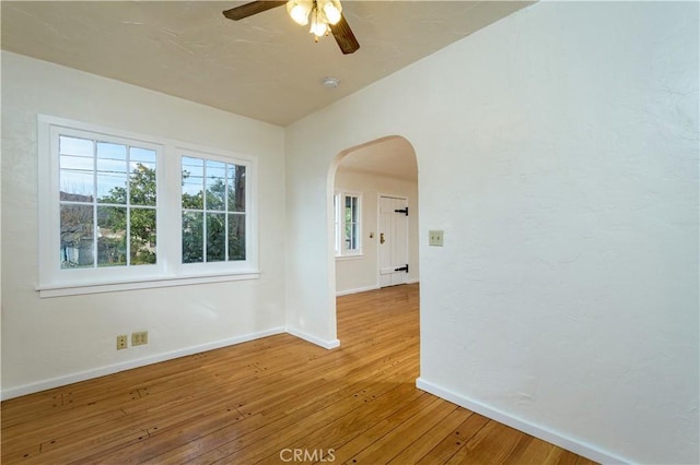 spare room featuring ceiling fan and light hardwood / wood-style floors