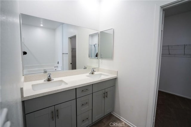 bathroom featuring vanity and a bathing tub