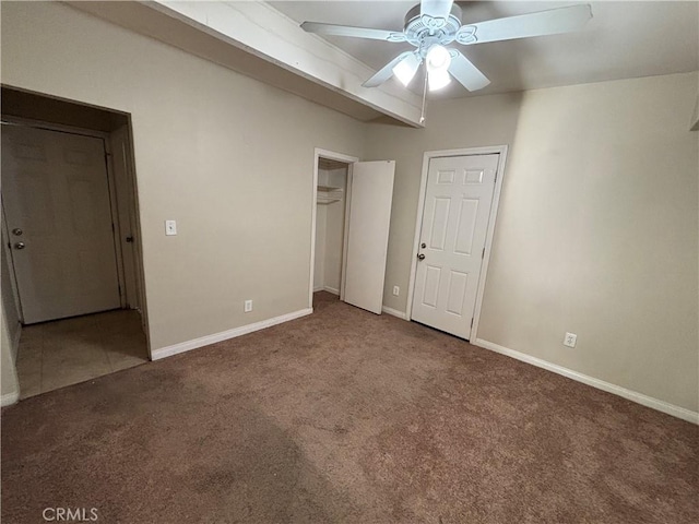 unfurnished bedroom featuring ceiling fan, a closet, and carpet