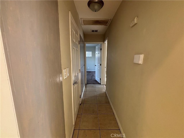 hallway with light tile patterned floors