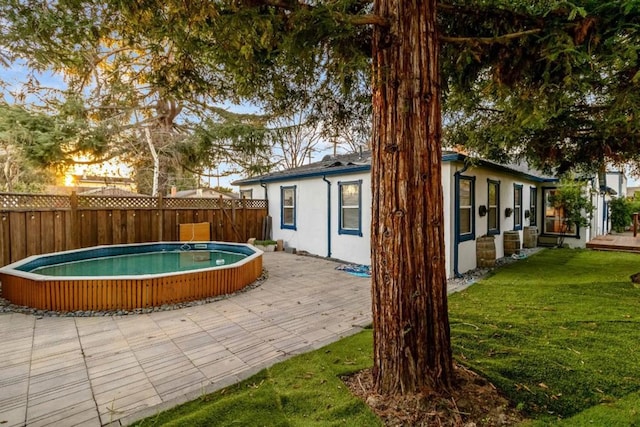 exterior space featuring a yard and a patio