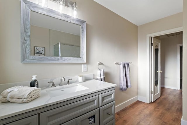 bathroom featuring vanity and hardwood / wood-style floors