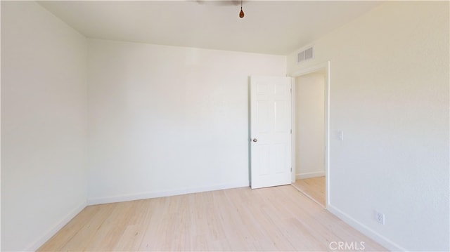 unfurnished room featuring light wood-type flooring